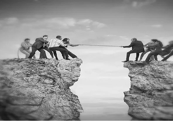 A group of people on top of a cliff.